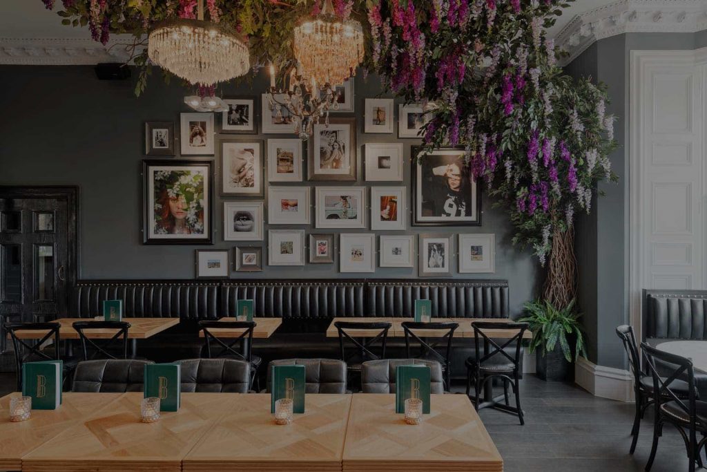 Black Ivy luxury bar seating area with wall mural